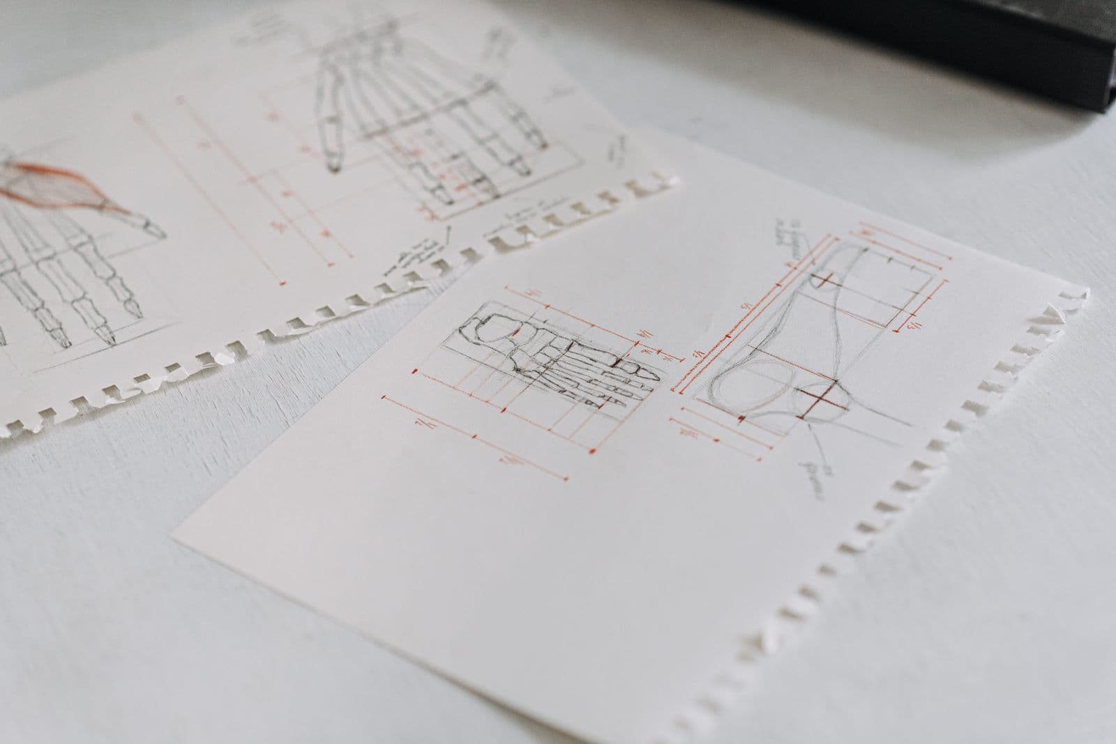 Hand-drawn technical concept sketches with measurement annotations
